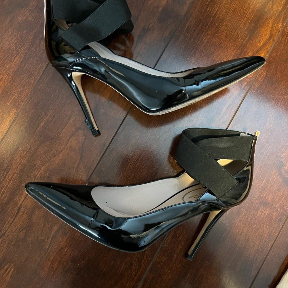 SJP black patent heels
